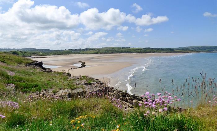 Lligwy Beach is a lovely sheltered bay with swathes of golden sand - perfect for family days out.